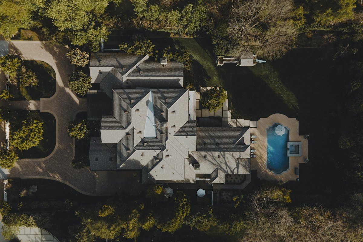 Aerial view of a private house set among trees