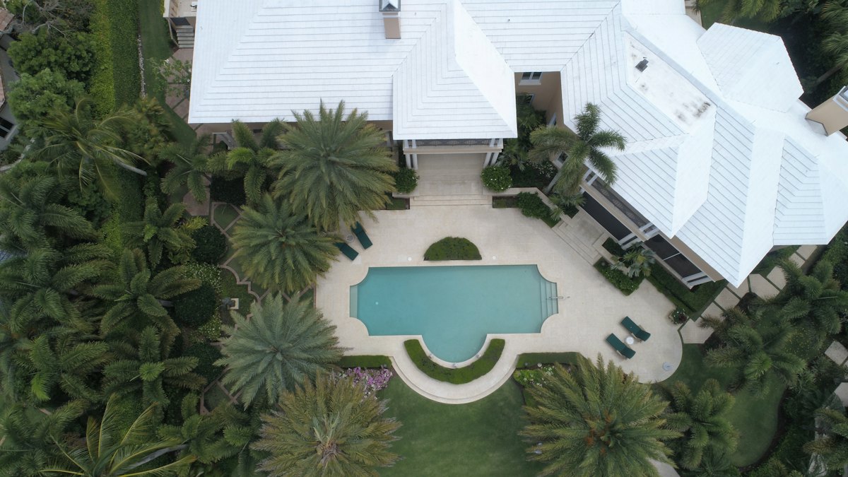 Aerial view of a house with a swimming pool